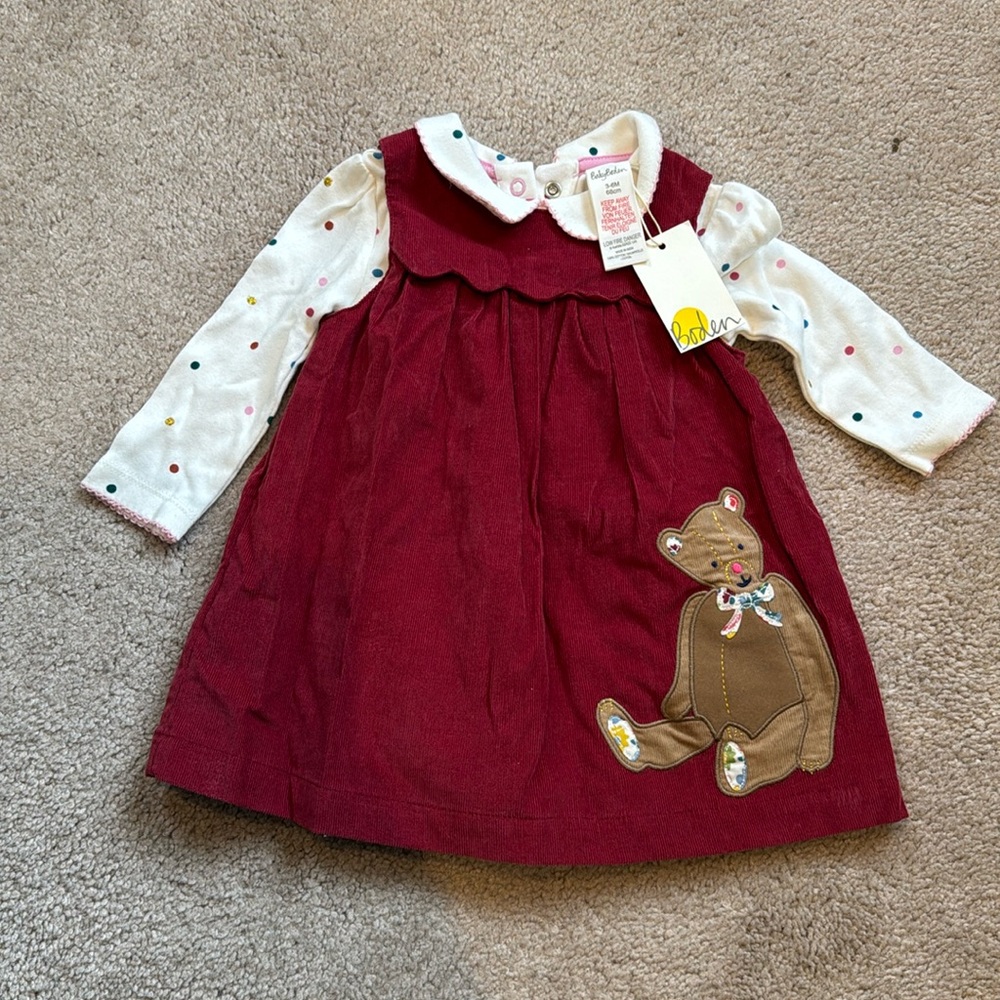 Baby Biden jumper dress with onesie.